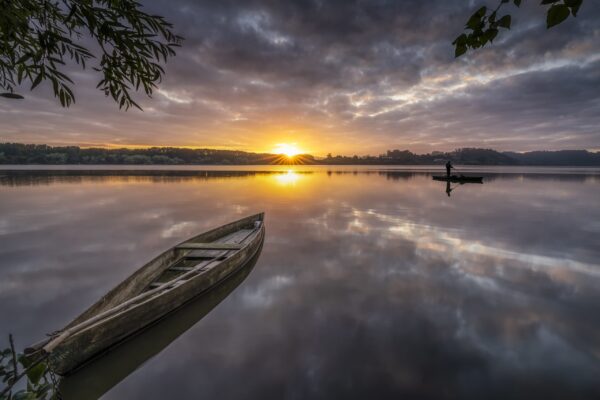 Fototapeten Boot bei Sonnenuntergang